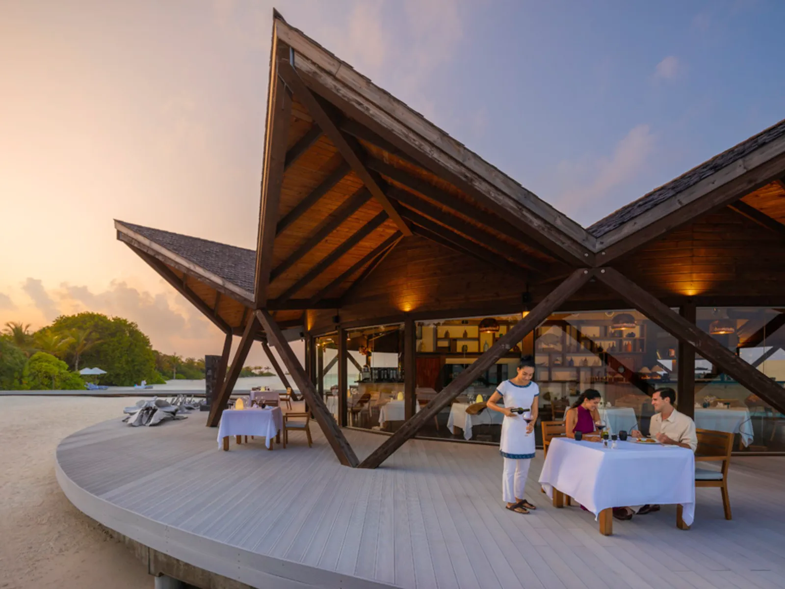 Bodumas at dusk, its pointed roofs over the terrace on the sea