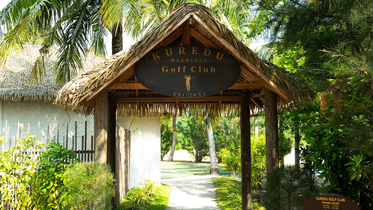 The Kuredu Golf Club entrance among trees