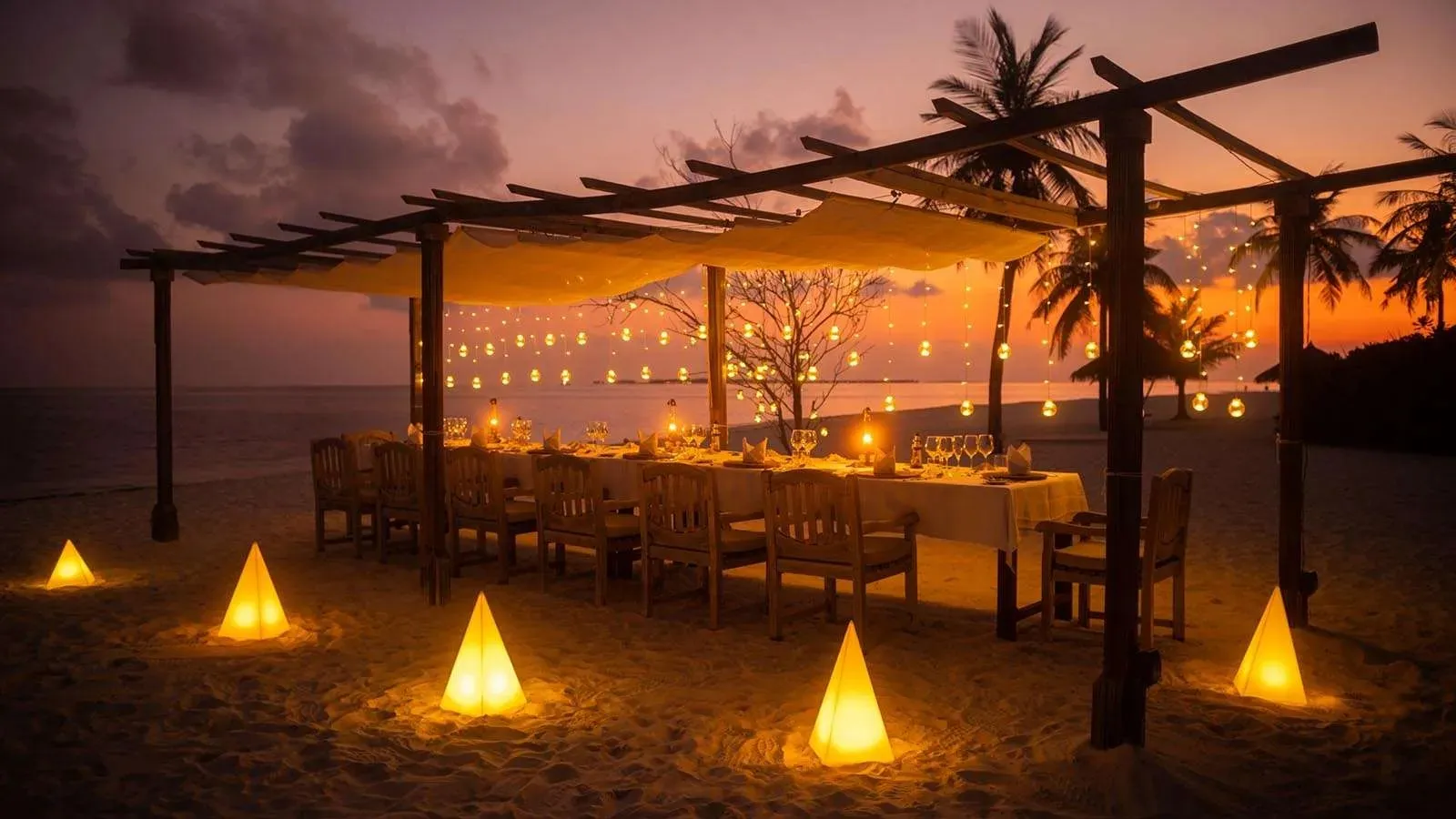 A private dinner table lit at sunset