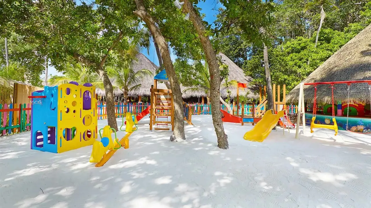 Colourful kids’ club playground among trees