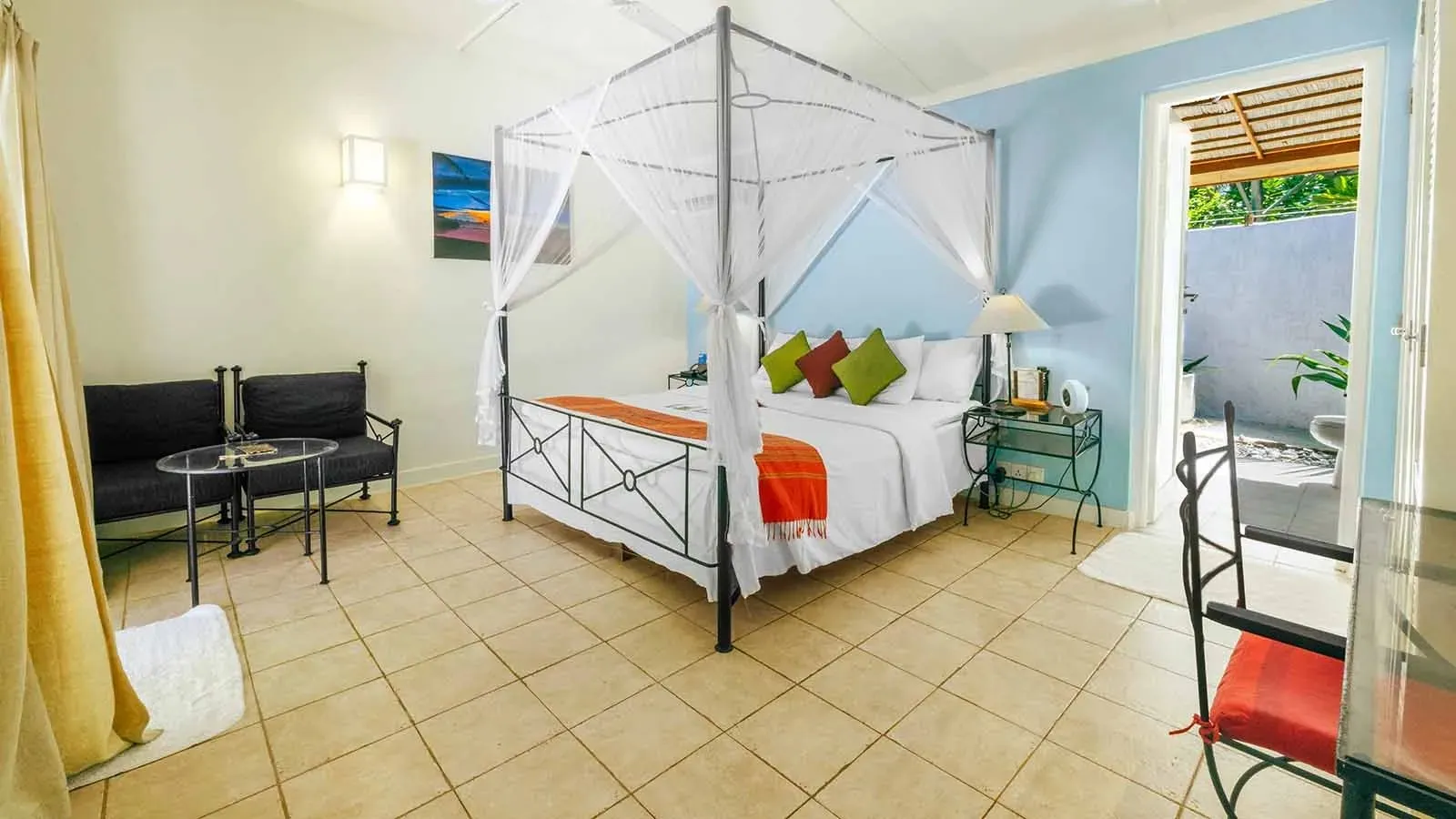 Beach Bungalow bedroom with a white four-poster bed