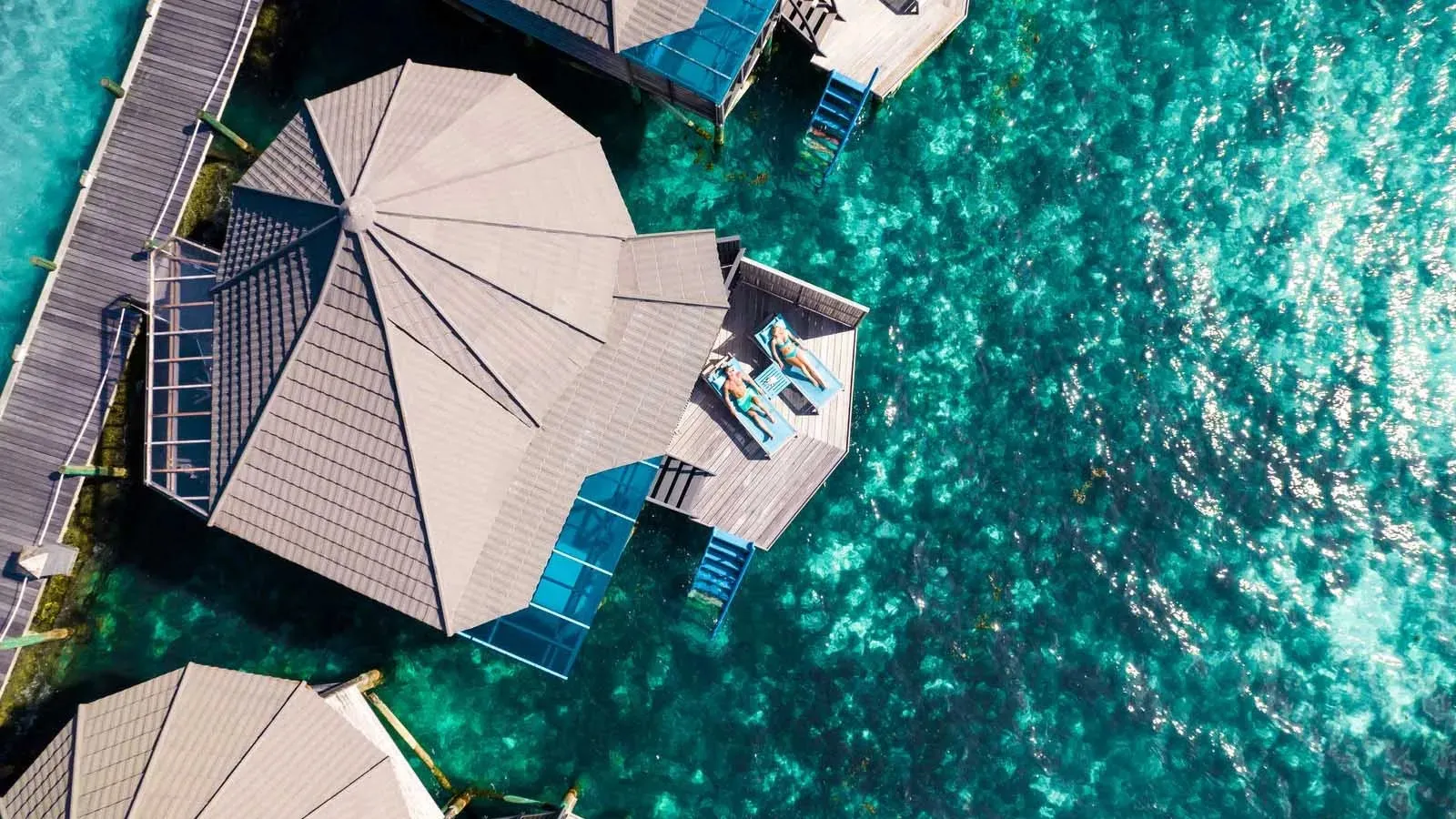Villas on the jetty above turquoise water, seen from above