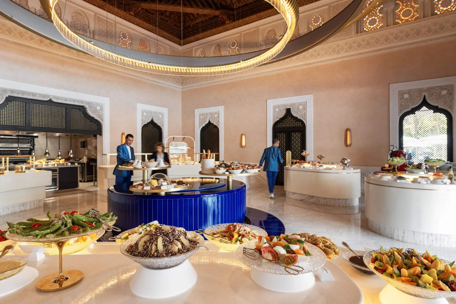 The breakfast buffet under a ring chandelier