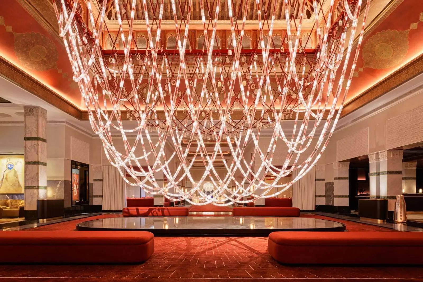 A salon under a chandelier of glass strands