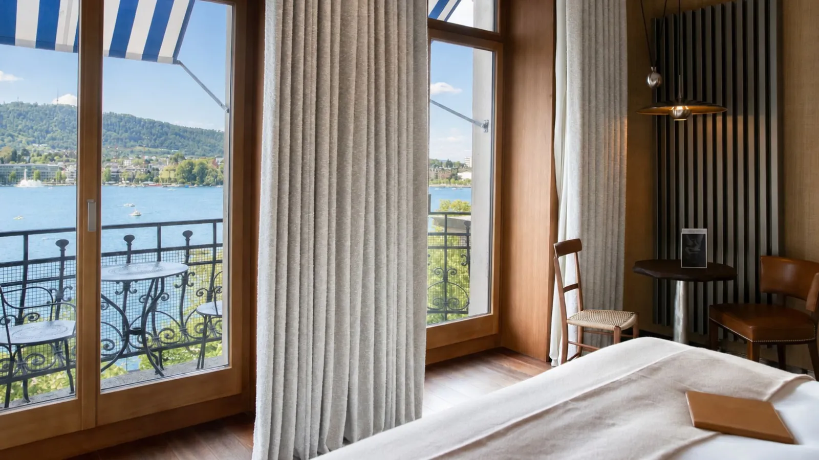 Balcony doors open towards the lake
