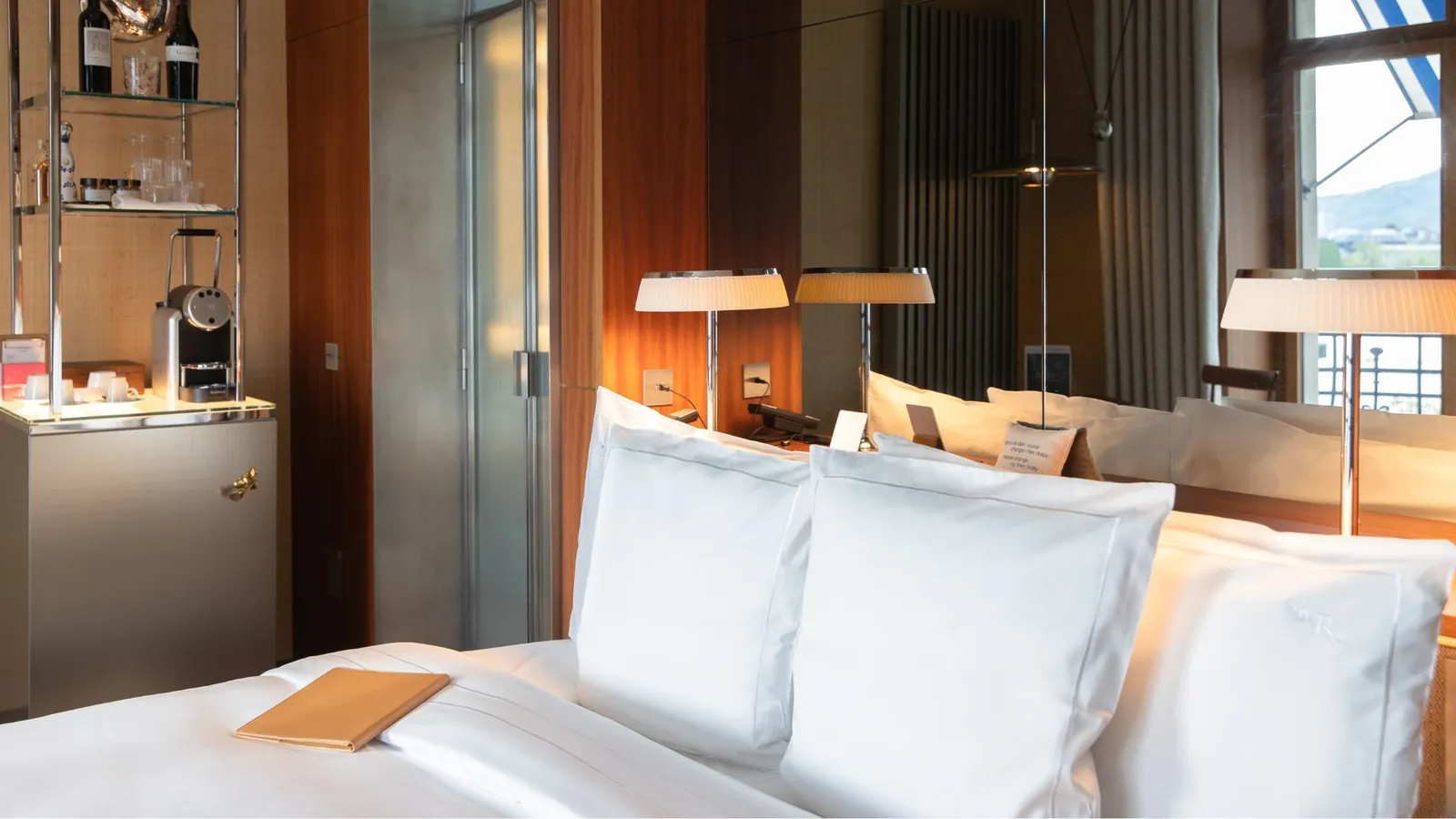 Bed and wood-panelled wall