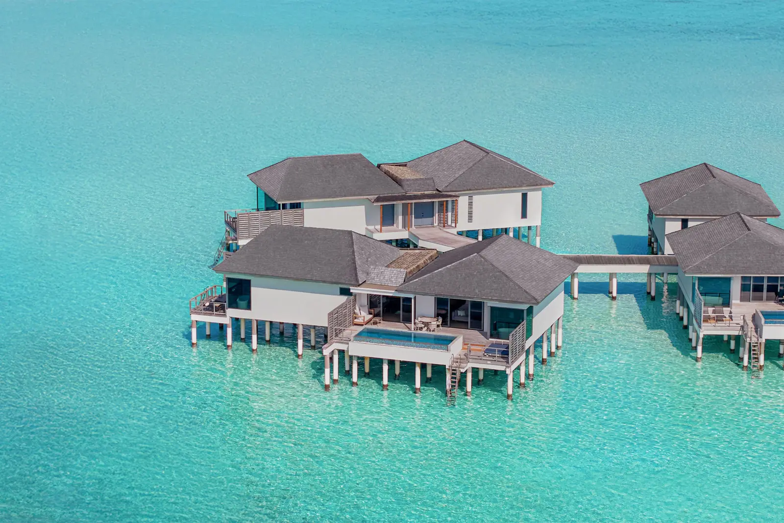 A Two Bedroom Overwater Pool Villa from above, over the lagoon