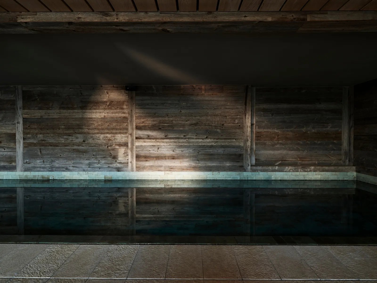 La piscina interna con pareti in legno