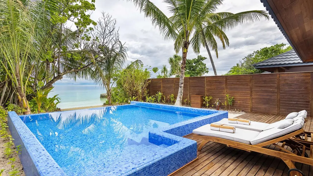 The Beach Residence’s large pool, loungers on the deck