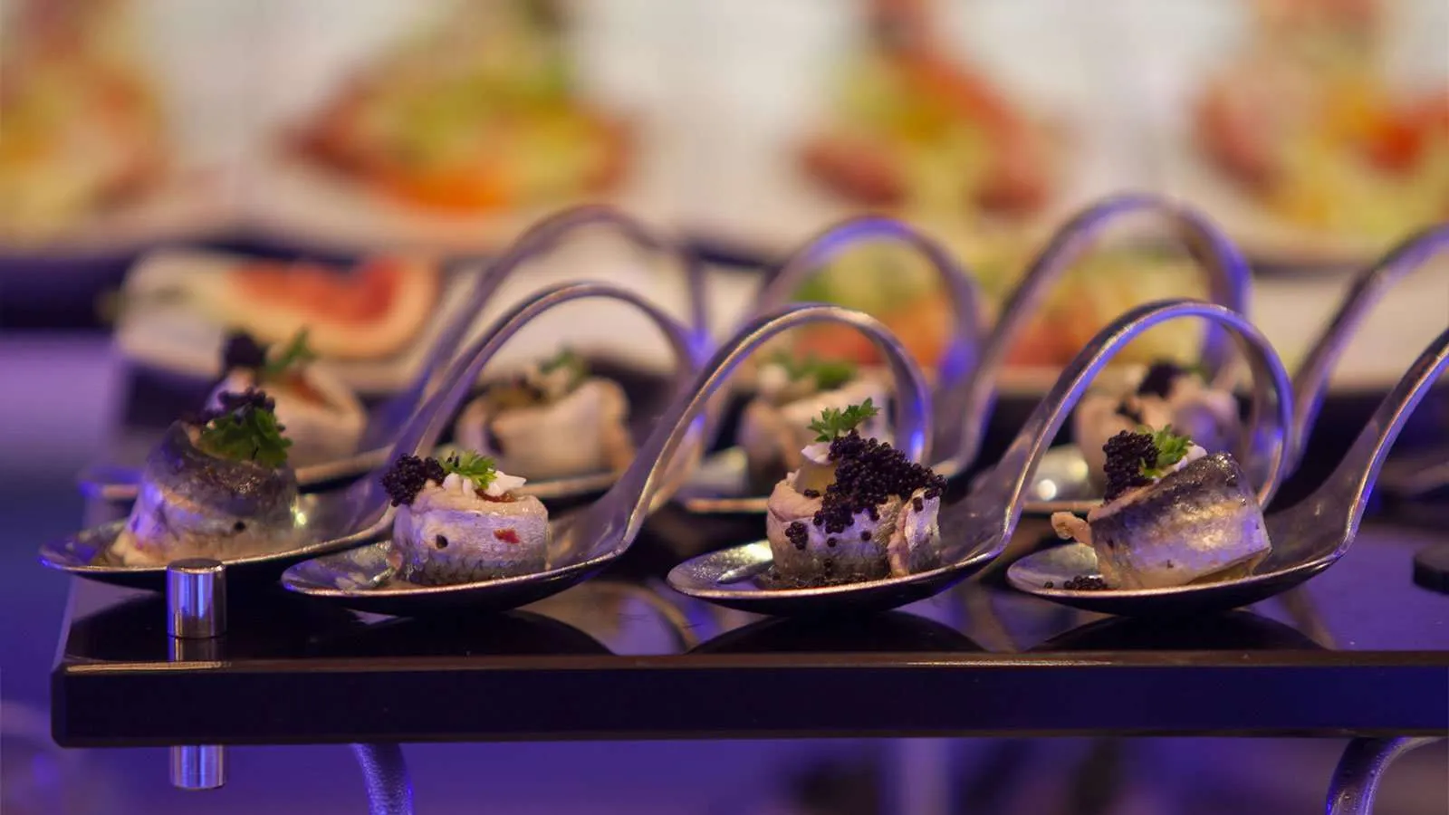 Seafood starters served in spoons at the seafood night