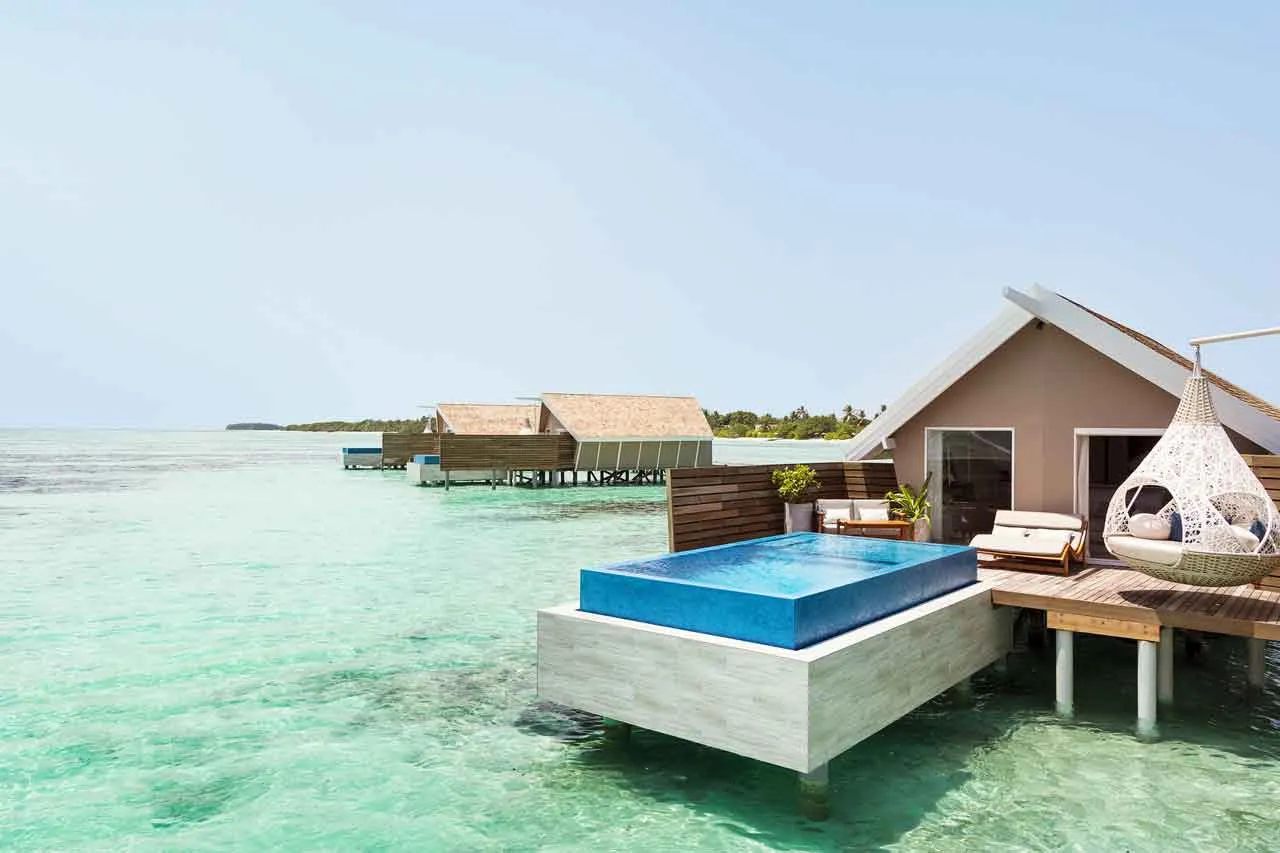 An Overwater Infinity Pool Villa, its deck pool and nest swing