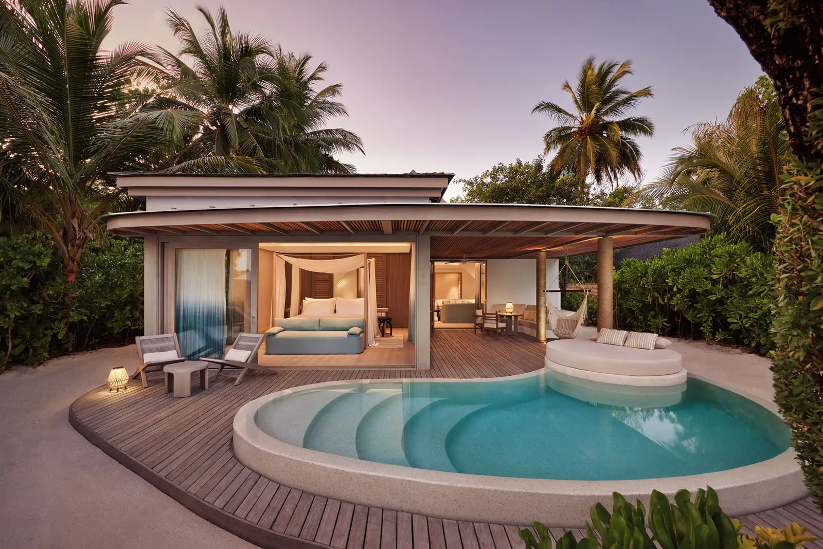 The Temptation Beach Pool Villa, its pool and furnished patio