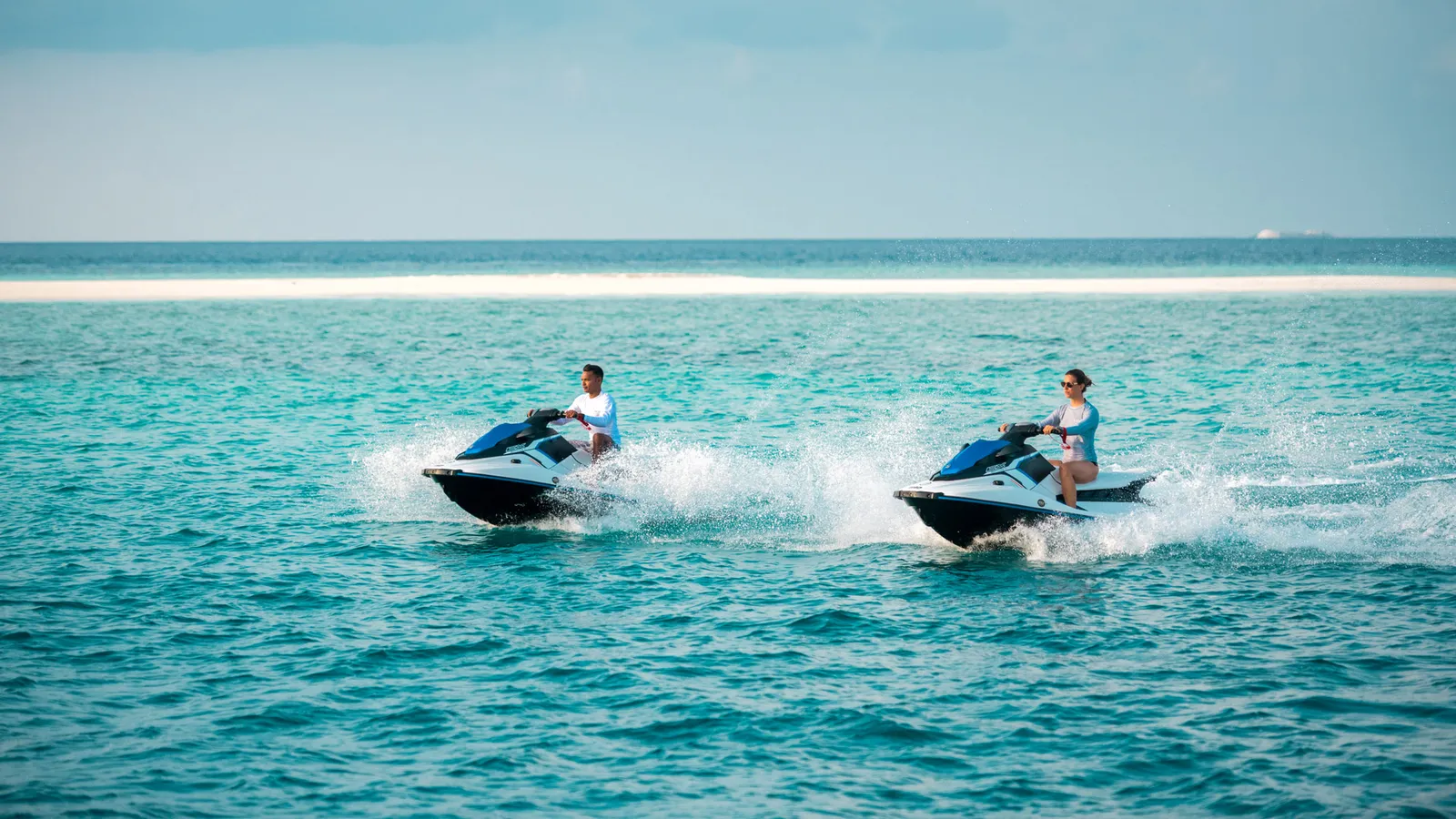 2 jet skis crossing the turquoise lagoon