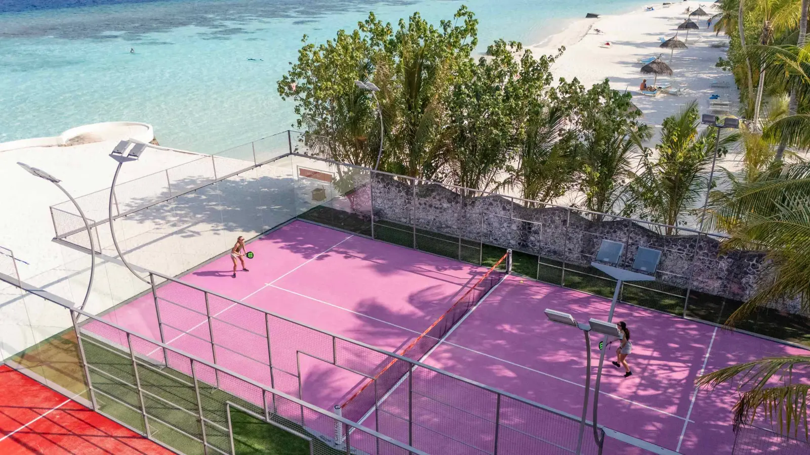 The padel courts from above, beside the beach.
