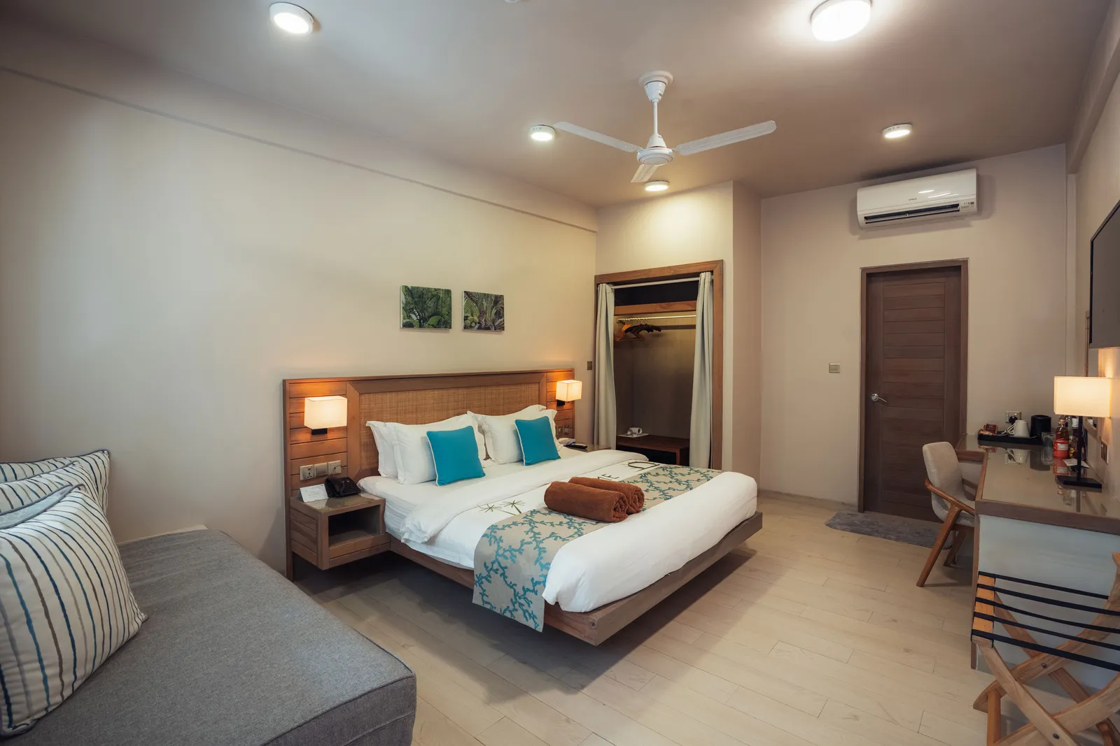 A Garden Room: the double bed, the sofa bed on the left, the desk and the open wardrobe.