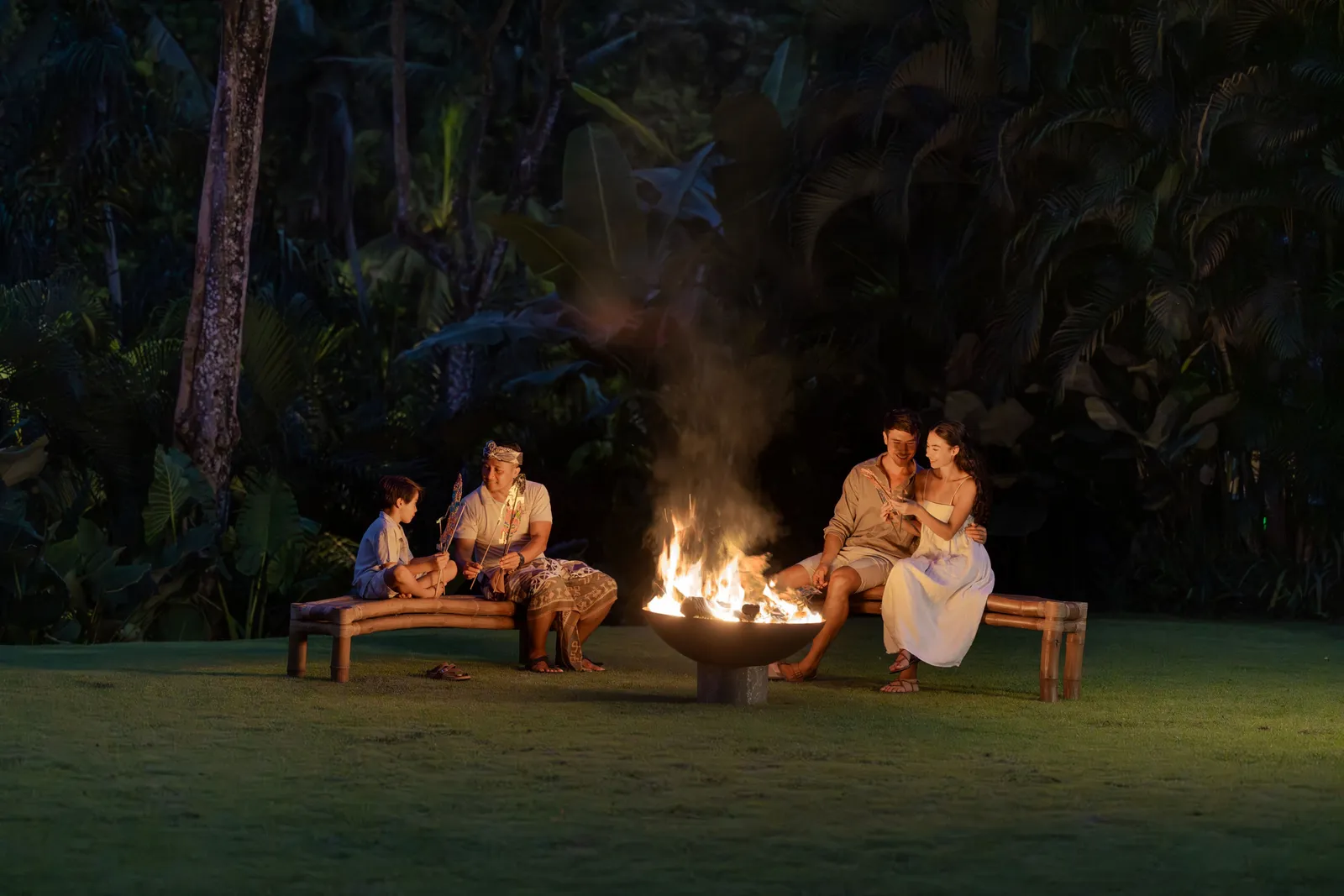 Mandapa Camp’s evening bonfire on the lawn, guests sitting round it