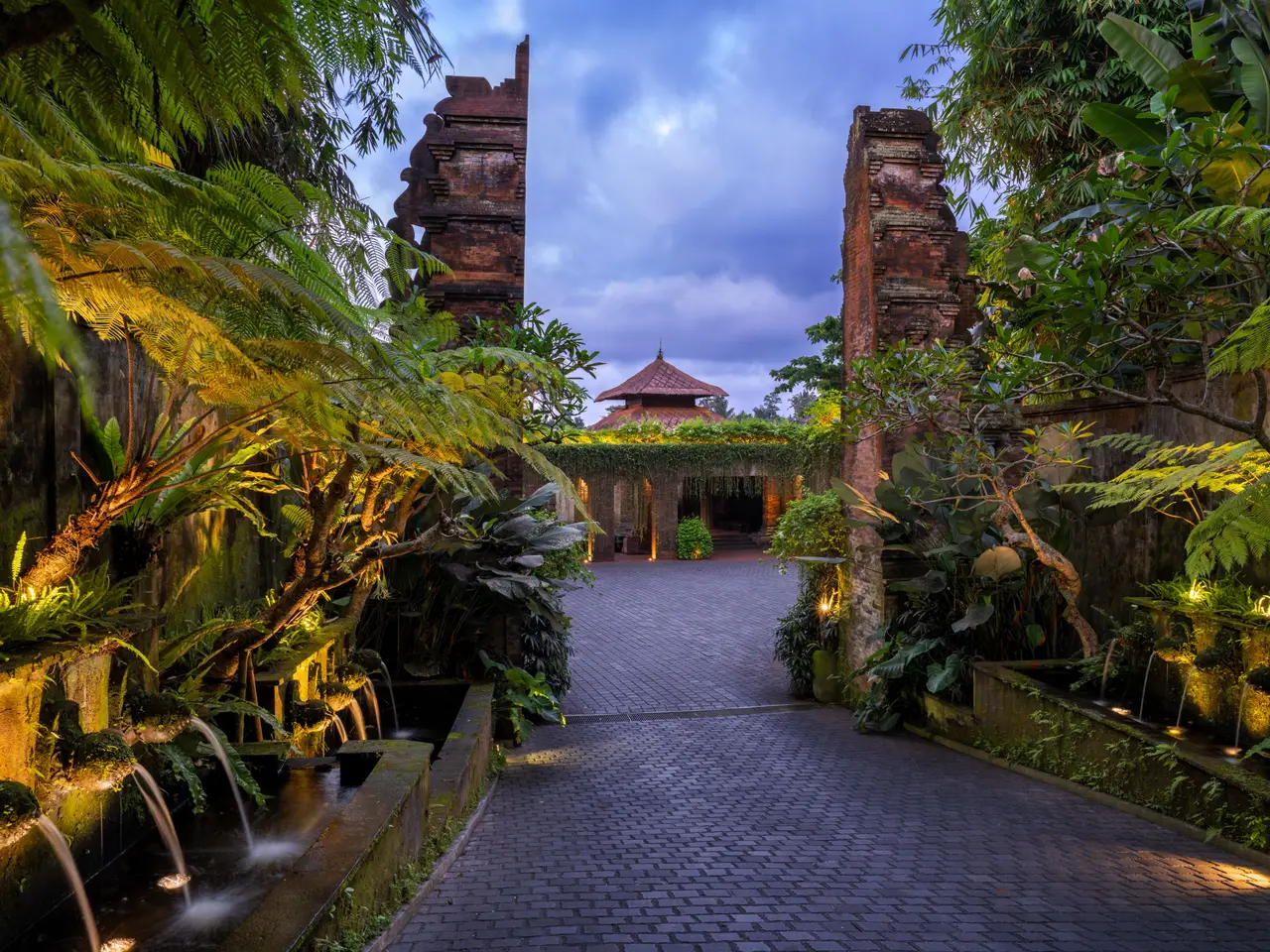 The brick entrance gate and the drive to the Wantilan