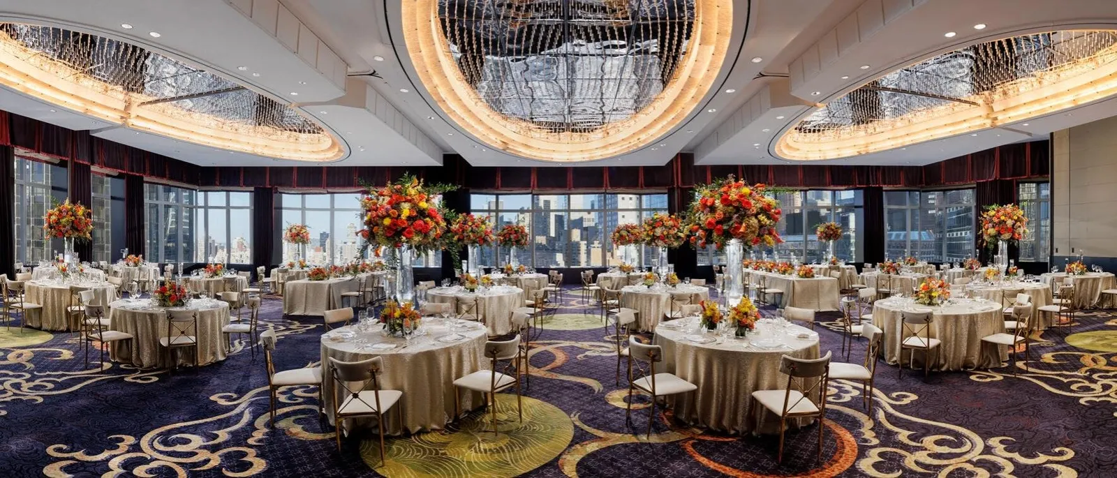 Laid tables and oval chandeliers in the Mandarin Ballroom