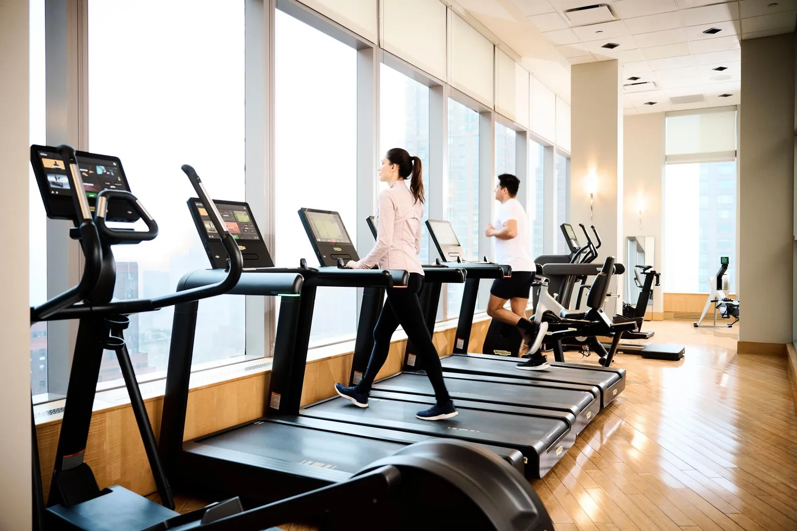 Treadmills beside the fitness centre windows