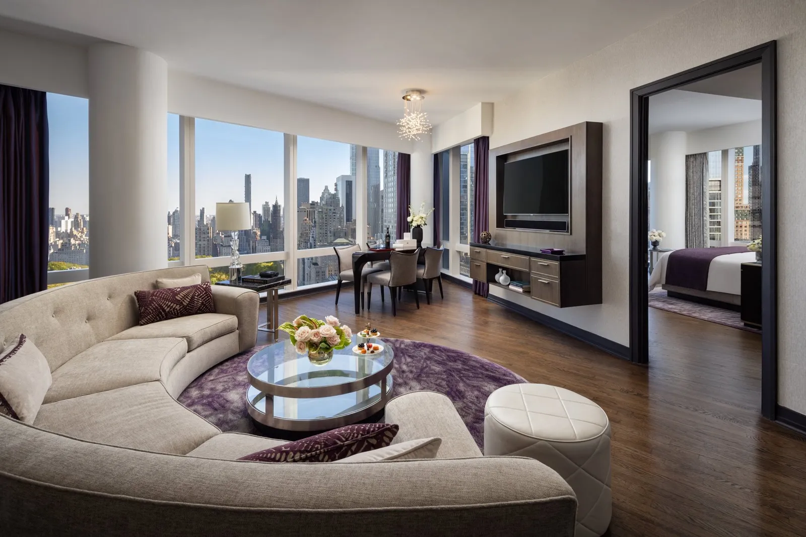Amethyst-toned living room with an open door to the bedroom