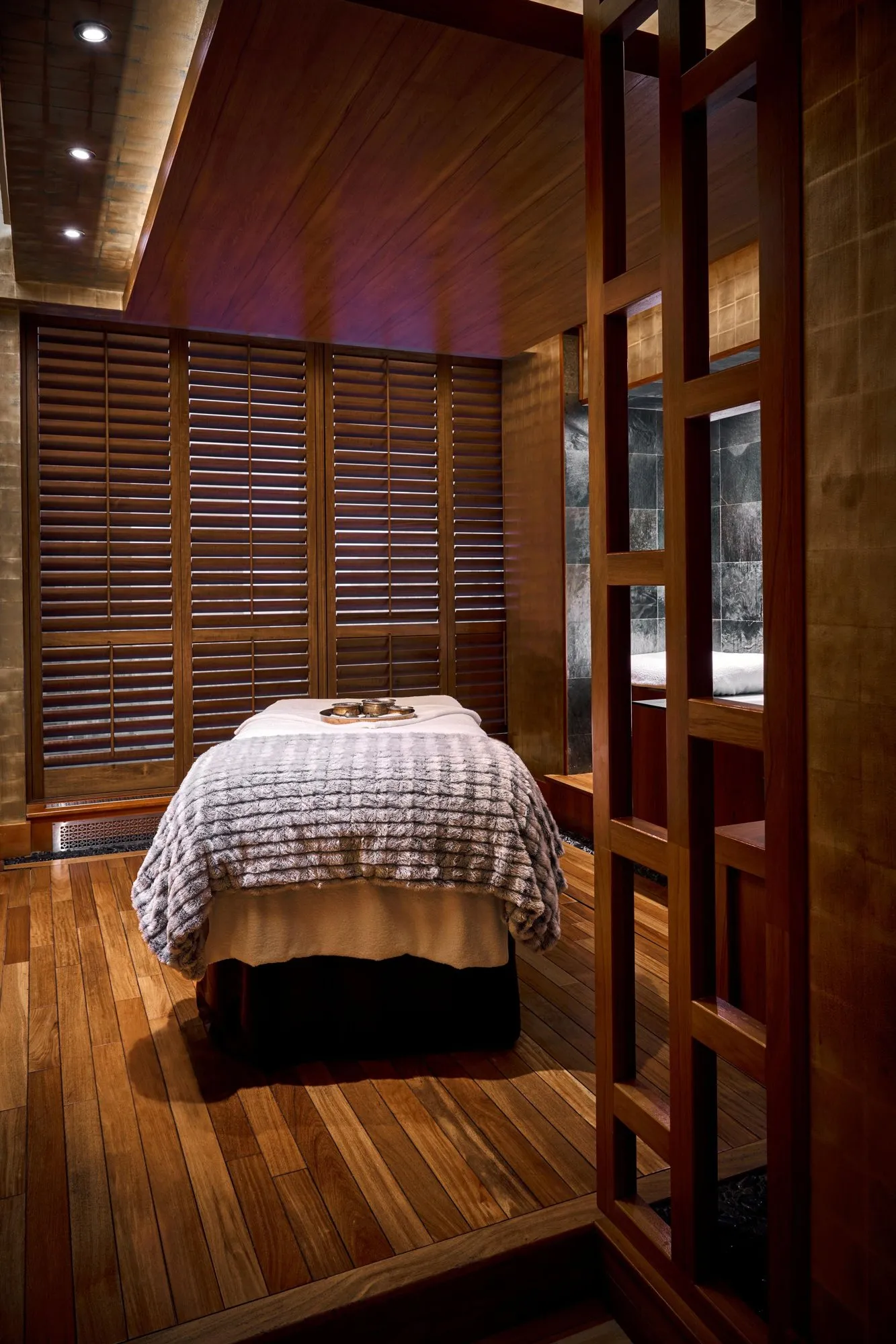 Treatment couch inside the wood-lined Thai Suite
