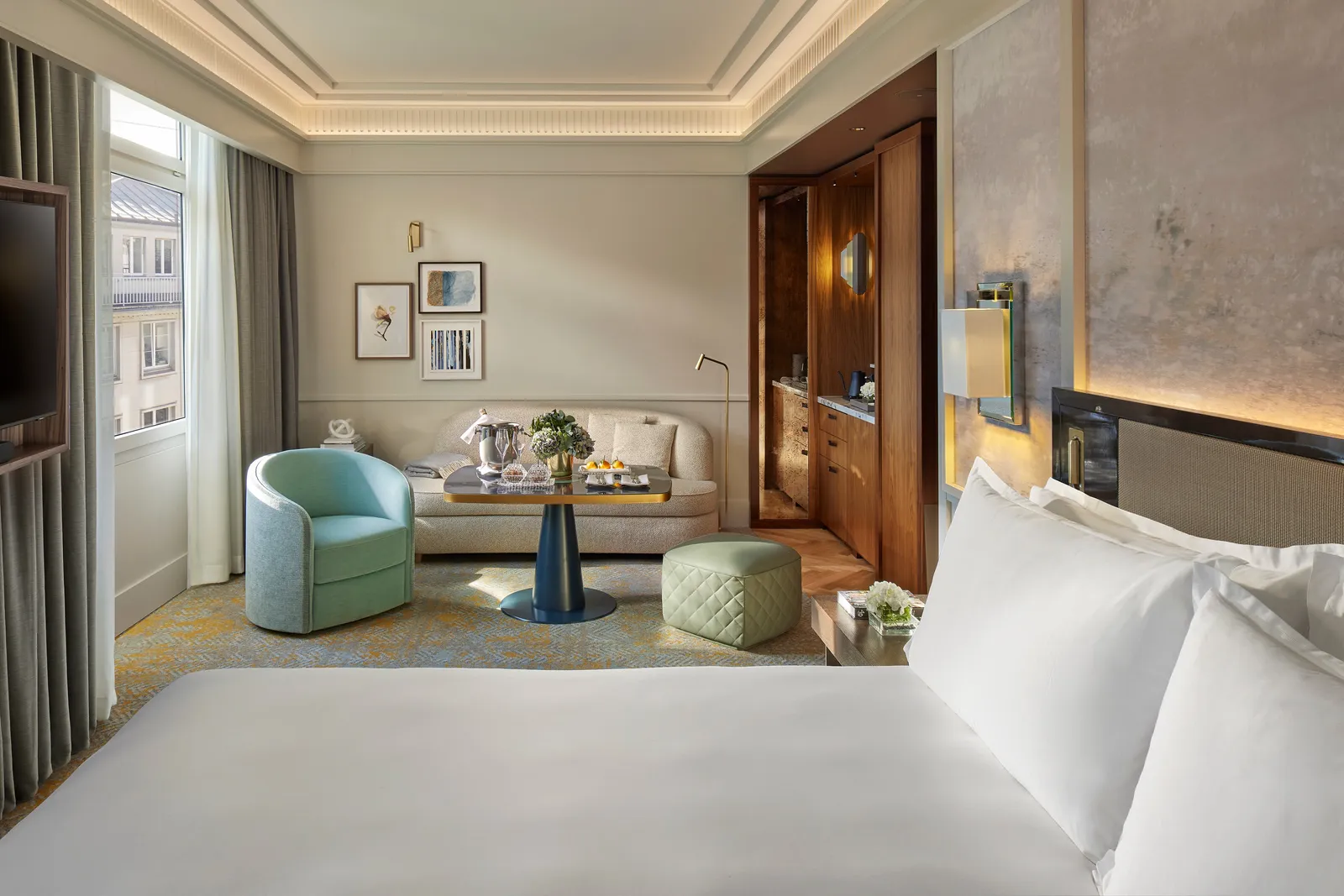 Bed and sitting area in one room of the connecting suite
