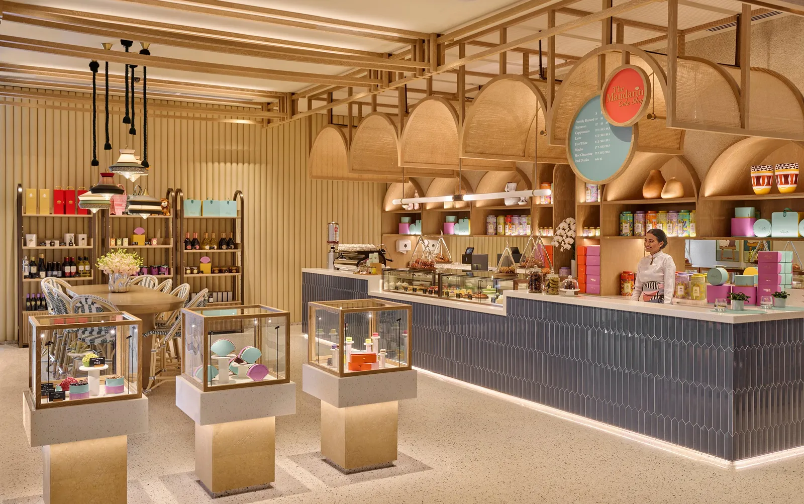 The Mandarin Oriental Cake Shop: the cake counter, glass cases of pastries and shelves of coloured boxes.
