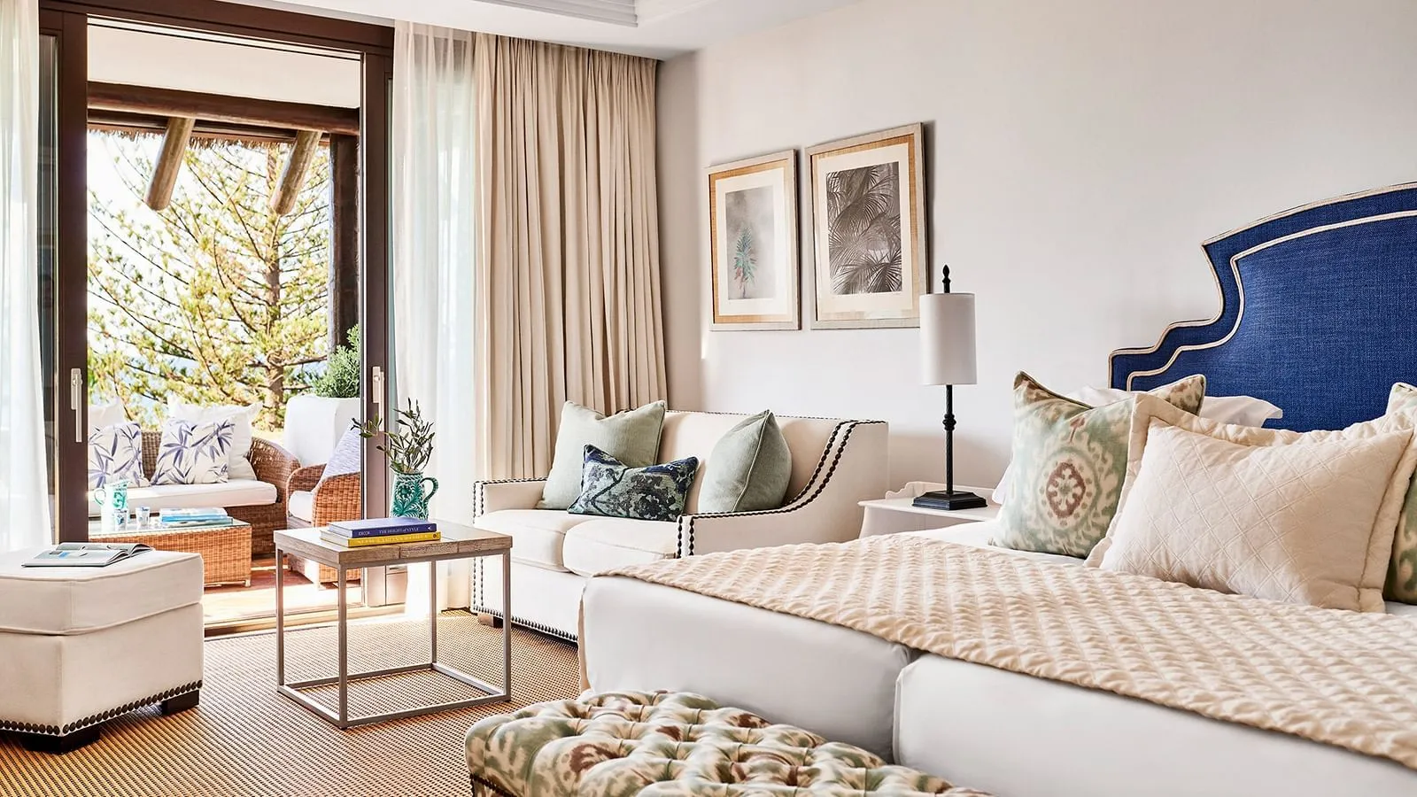 Bed and sofa in a Deluxe Room with Sea Views