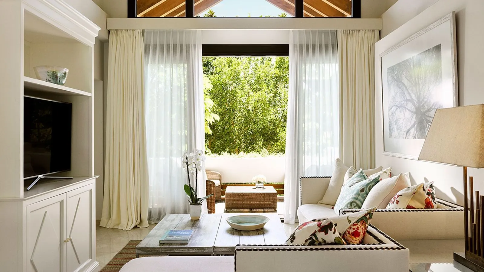 MC Suite sitting room with a sofa and glazed doors