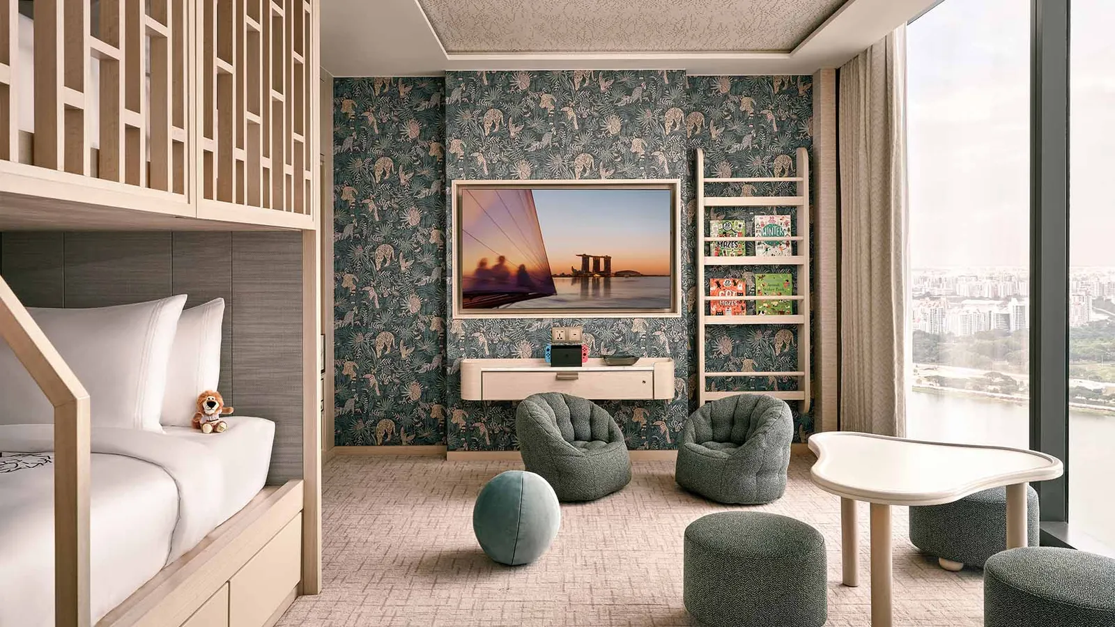 Paiza Family Suite: the children’s room with a bunk bed, beanbags and blue wallpaper.