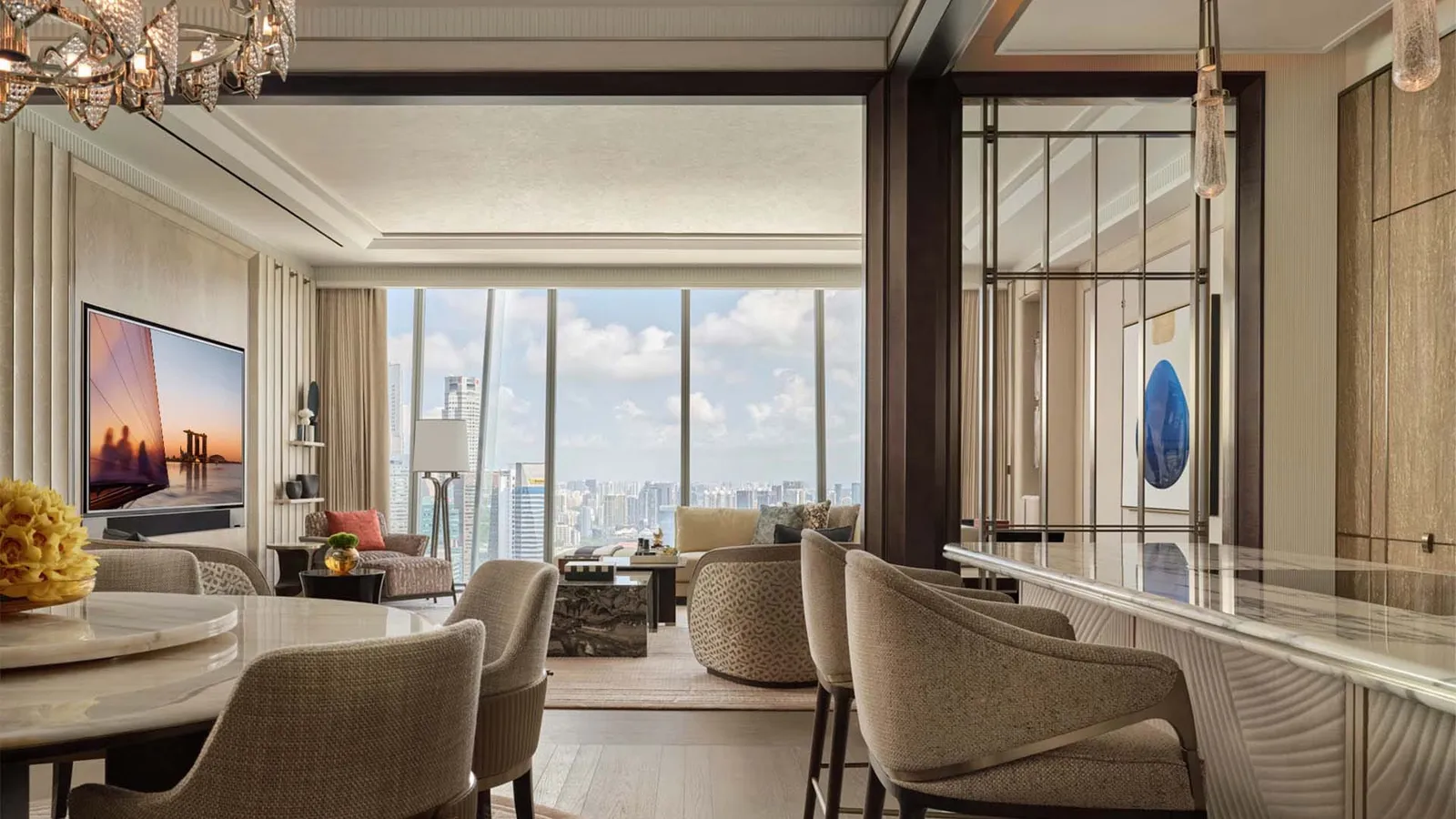 Presidential Suite: the dining table and the sitting room, the city beyond the windows.