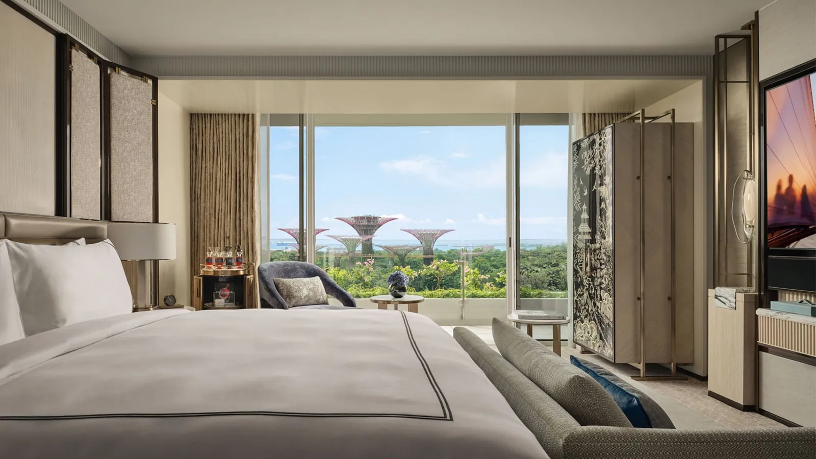 Sands Premier Room: the bed facing the window, the Supertrees of Gardens by the Bay beyond.