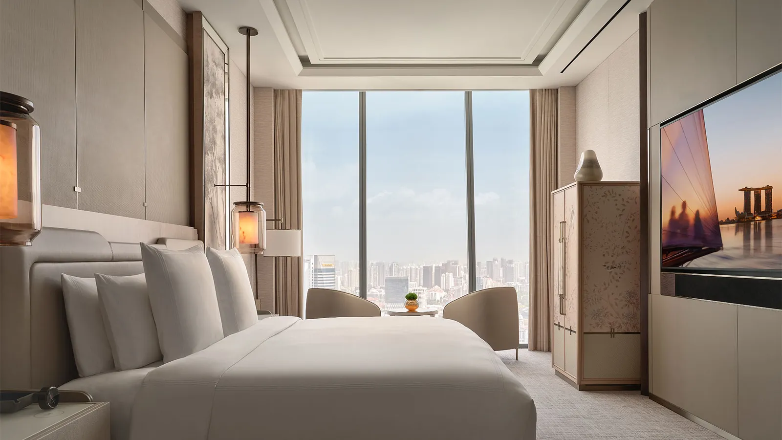 Skyline Suite: the bedroom with the bed facing the window on the city.