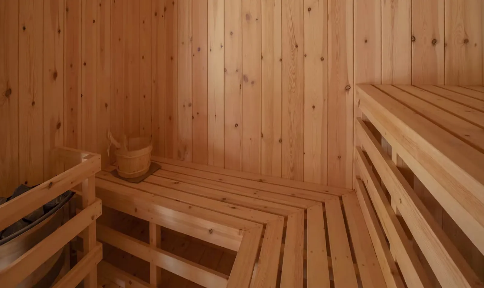 The spa’s sauna, with its pale timber benches.