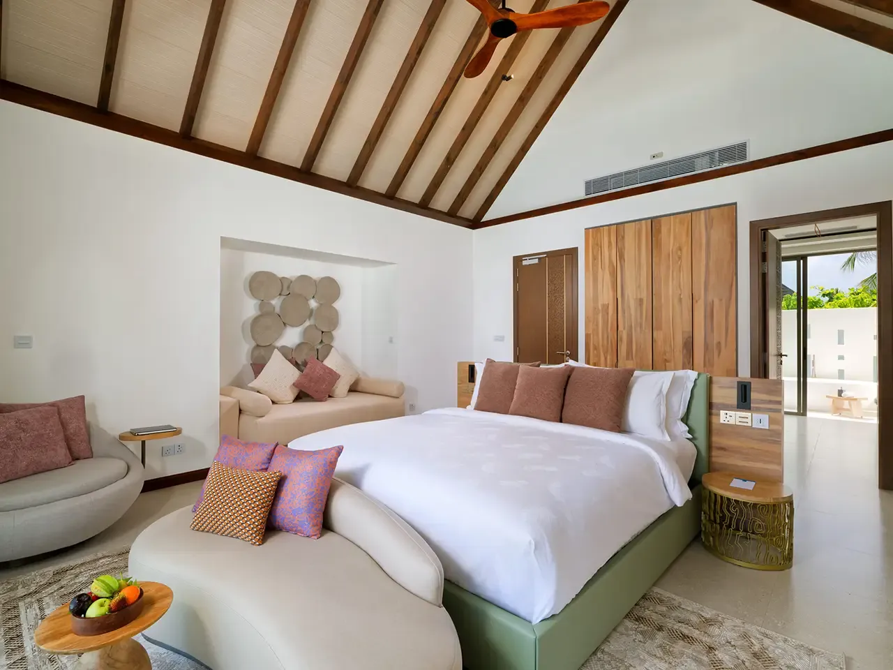 The bedroom with its bed and sofa.
