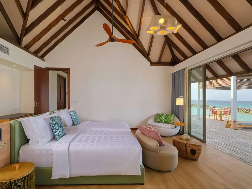 The bedroom with its bed and sofa.