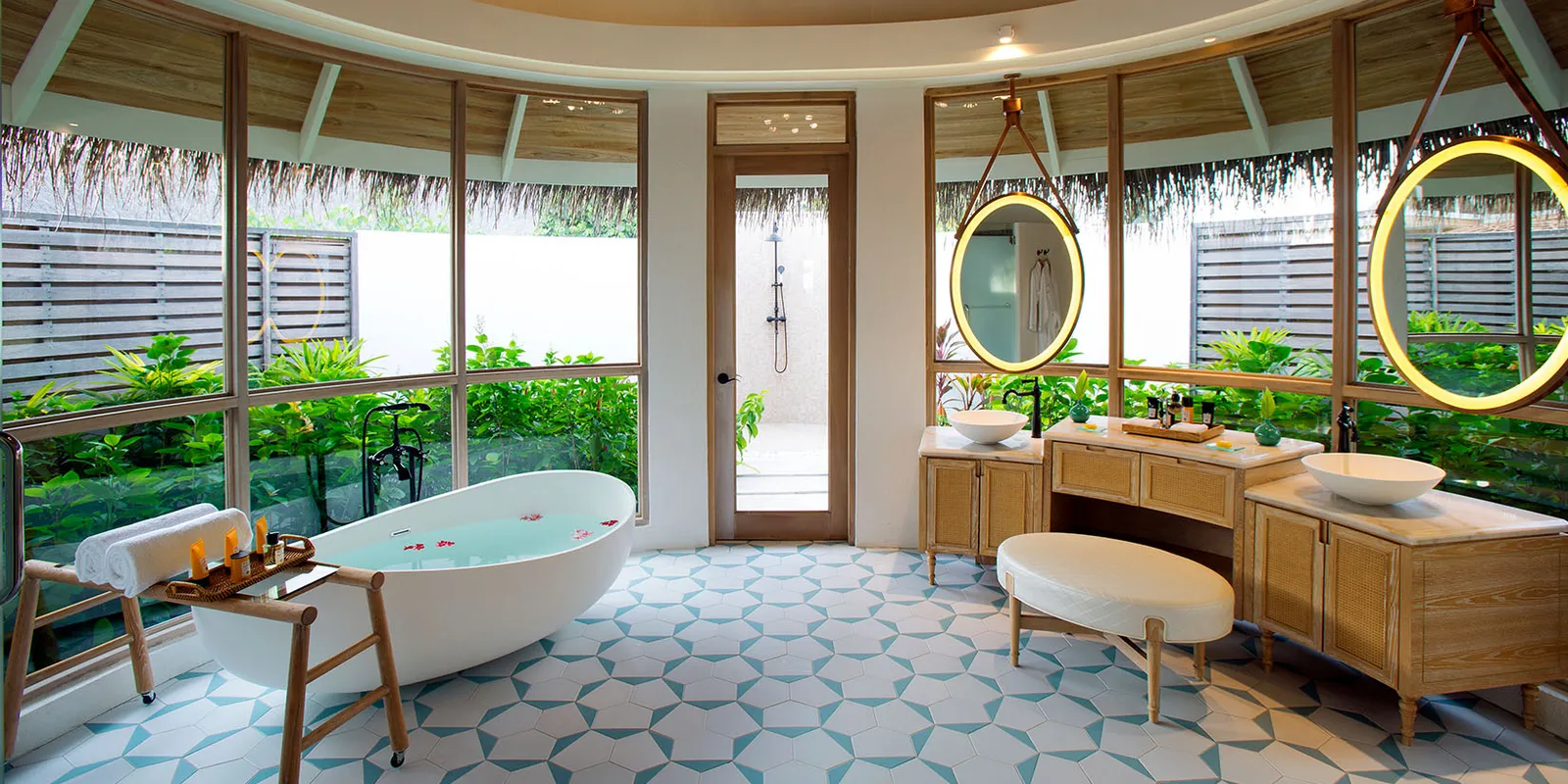 A Beach Pool Villa’s bathroom, the tub and the windows onto the garden