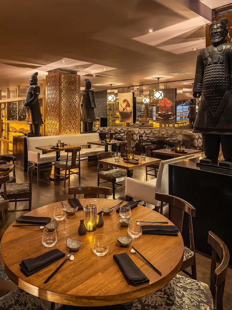 Set tables and a timber ceiling at Momo restaurant
