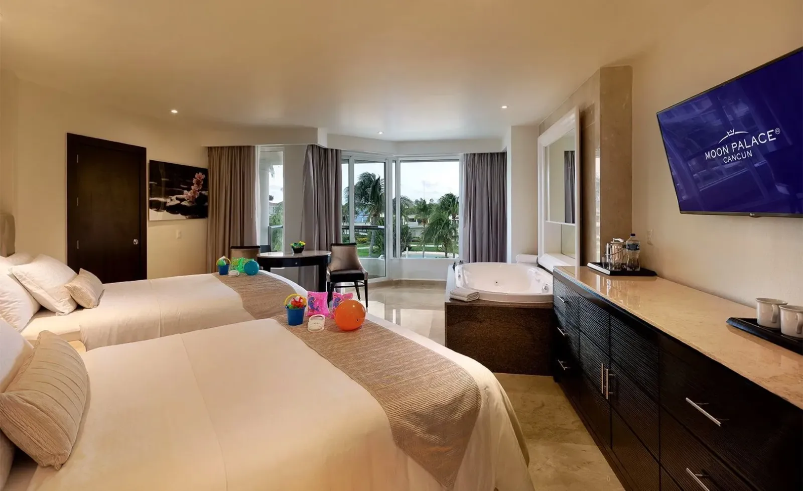 The bedroom with 2 beds and small toys in a Superior Family Deluxe