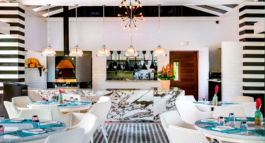 Tables and the wood-fired oven at Mis Amores