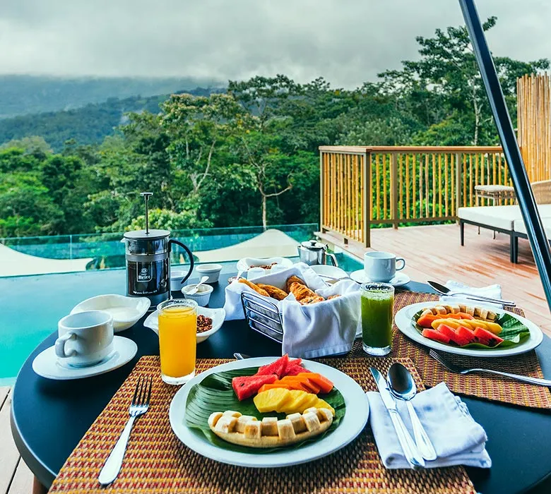 Breakfast on the terrace, with fruit, waffles and the private pool beyond