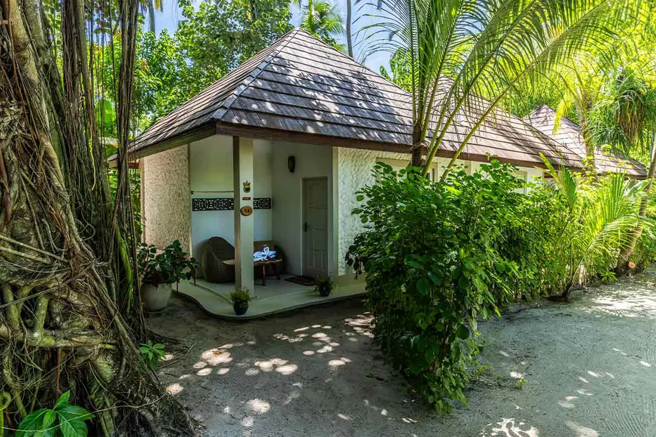 A Garden Room, the small pitched-roof cottage hidden among the garden’s trees.