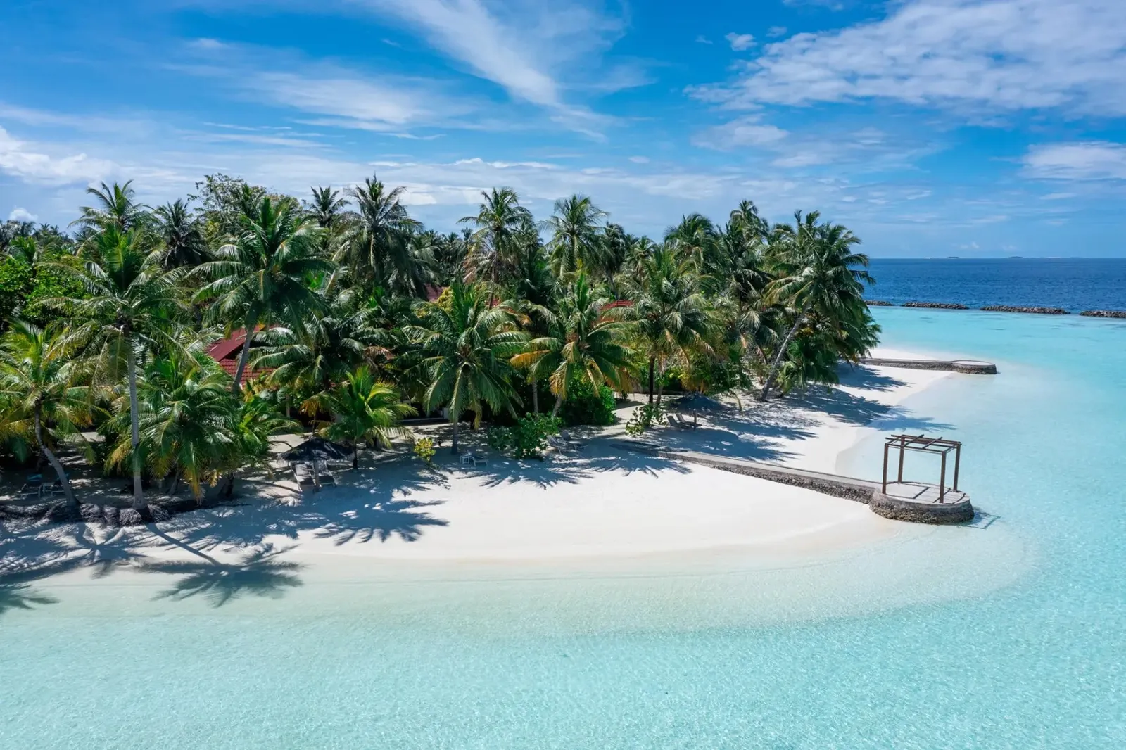 Kurumba’s beach from the air, clear water and palms