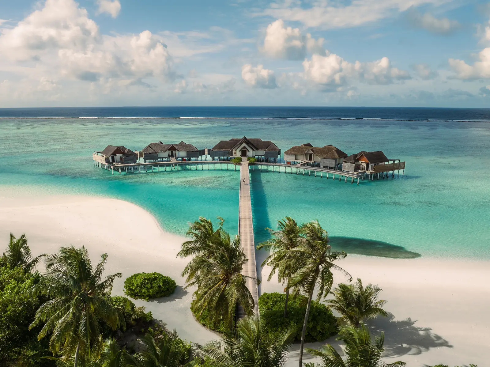 The Crescent from above: the private boardwalk leading to 5 pool villas in the middle of the lagoon