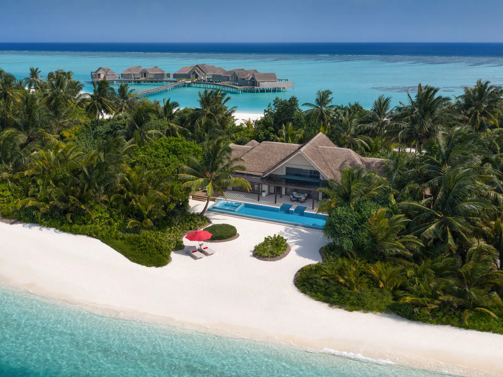 A 2-bedroom beach pavilion from above, its pool facing the sea