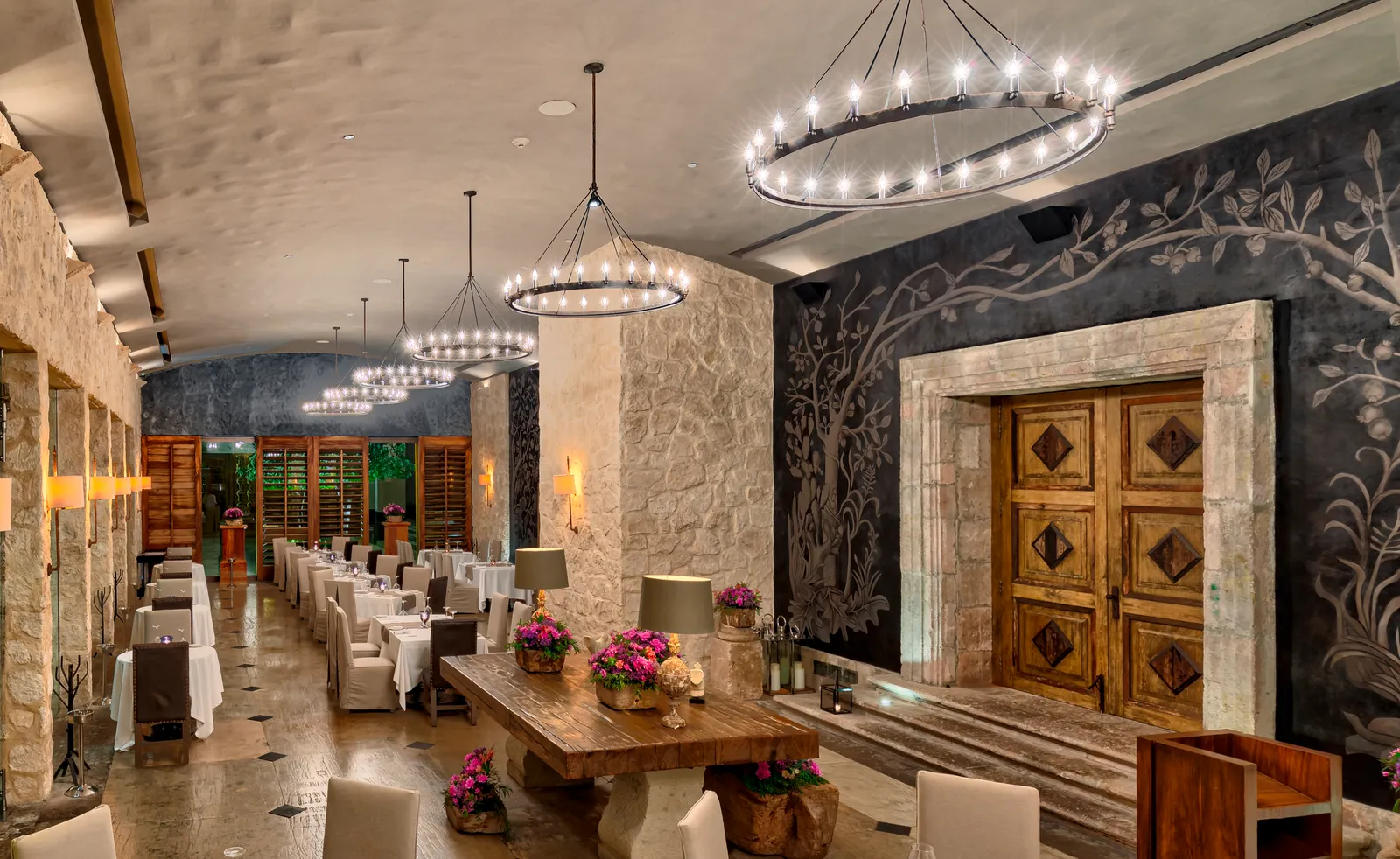 Ramona’s dining room with chandeliers and decorated walls