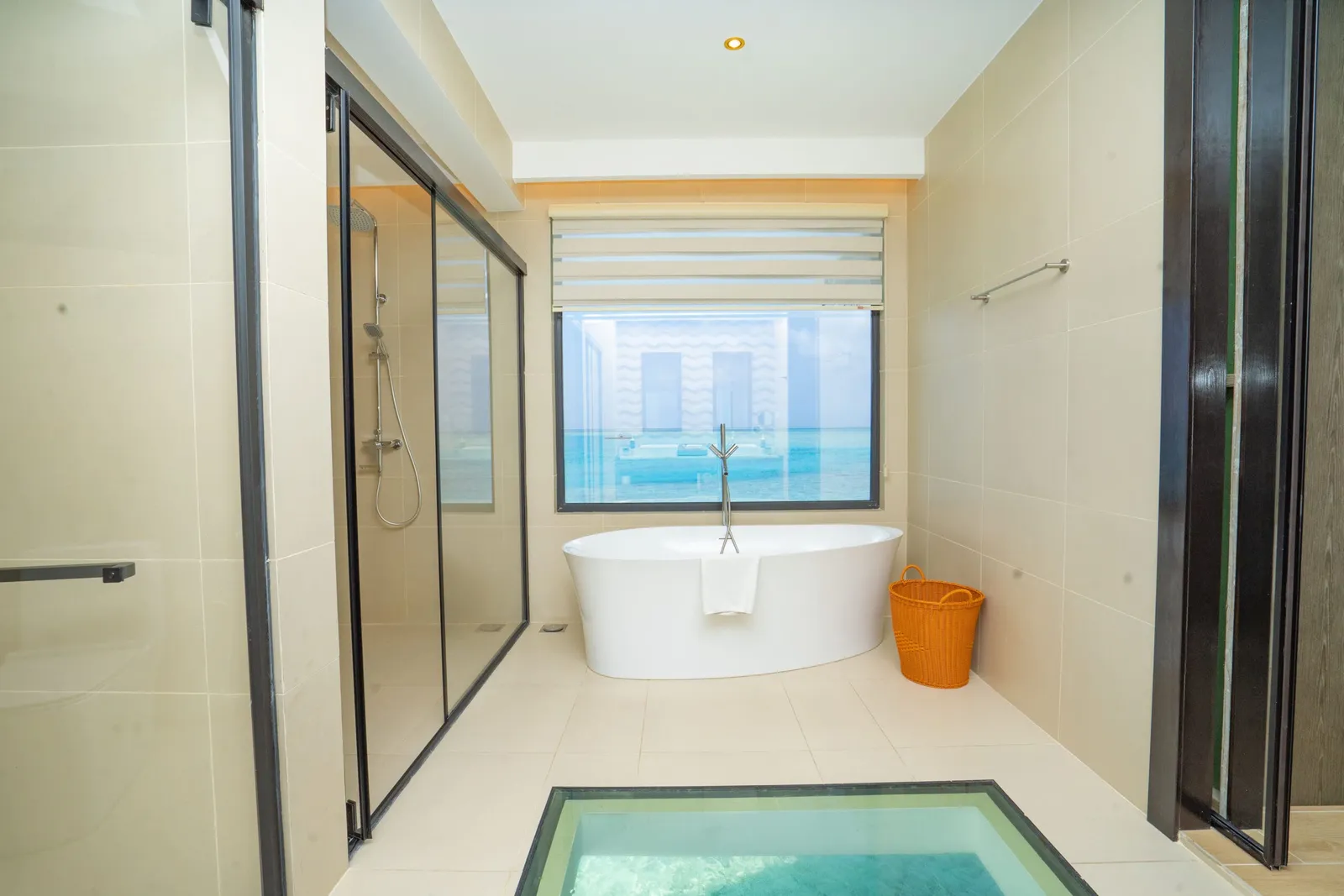 Sea-facing bath and glazed floor panel in Grand Atlantis