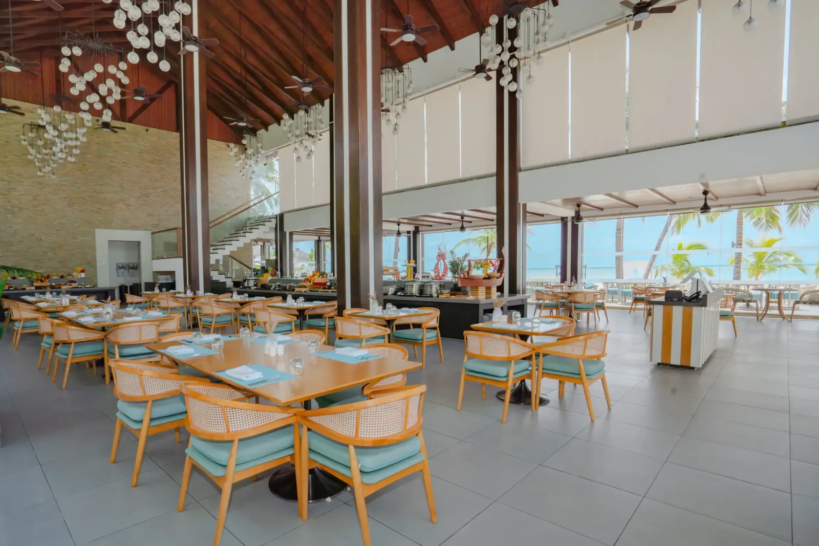 Tables and buffet beneath Iru’s high ceiling