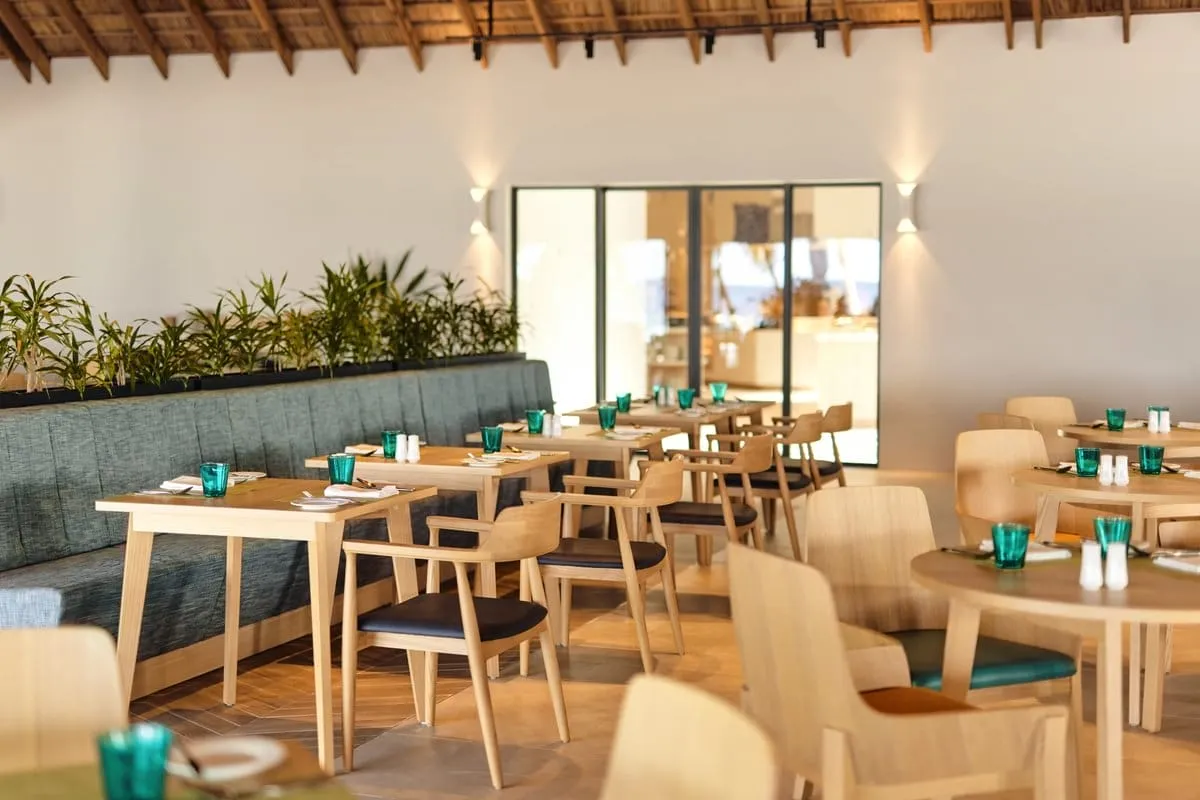 Wooden tables and blue glasses at Soul Kitchen.