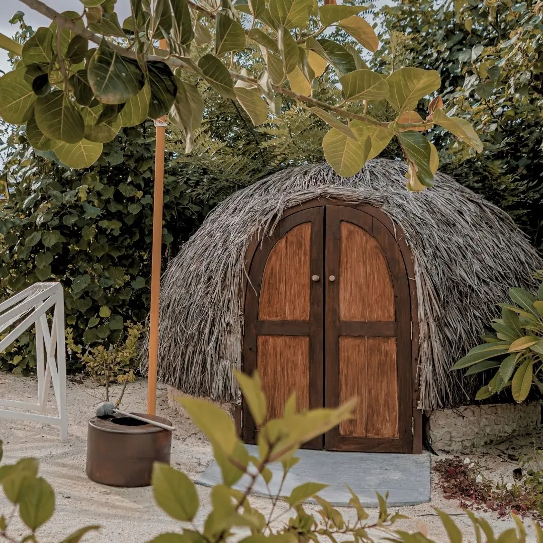 The Dhumashige, Hoba Spa’s igloo-shaped sweat lodge, with its thatched roof and arched wooden door.